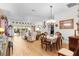 Open living and dining area with hardwood floors and abundant natural light at 747 Bradford Loop, The Villages, FL 32163