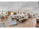 Spacious living room with hardwood floors, comfortable seating, and open floor plan at 747 Bradford Loop, The Villages, FL 32163