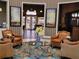 Inviting lobby with leather armchairs, a coffee table, and decorative accents at 79 Bayou Bend Rd, Groveland, FL 34736