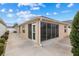 Enclosed patio with screen windows and sliding glass doors at 867 Parrish Pl, The Villages, FL 32163