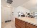 View of the entryway with a white door, coat hooks, and view into the kitchen and living area at 867 Parrish Pl, The Villages, FL 32163