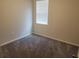 Empty bedroom with neutral walls and plush gray carpeting at 964 Rivers Crossing St, Clermont, FL 34714