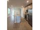 Modern kitchen with stainless steel appliances and large island at 964 Rivers Crossing St, Clermont, FL 34714