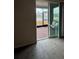 Living room with sliding glass doors leading to screened patio and pond view at 964 Rivers Crossing St, Clermont, FL 34714