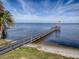 Private dock with gazebo overlooking the lake at 102 Cedar Way, Yalaha, FL 34797