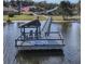 Community dock with seating and Waterwood signage at 102 Cedar Way, Yalaha, FL 34797