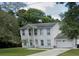 Two-story house with attached garage and yard at 1029 Kirk St, Orlando, FL 32808