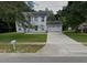 Two-story house with a driveway and yard at 1029 Kirk St, Orlando, FL 32808
