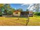 Large backyard with a screened porch and fence at 11451 Pala Verda Ave, Leesburg, FL 34788
