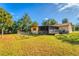 Large backyard with a screened porch and fence at 11451 Pala Verda Ave, Leesburg, FL 34788