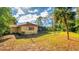 Large backyard with chain link fence and mature trees at 11451 Pala Verda Ave, Leesburg, FL 34788