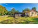 House exterior showcasing a screened porch and ramp at 11451 Pala Verda Ave, Leesburg, FL 34788