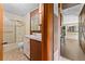 Clean bathroom with shower, vanity, and wood details at 11451 Pala Verda Ave, Leesburg, FL 34788