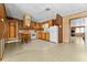Retro kitchen with wood cabinets and appliances at 11451 Pala Verda Ave, Leesburg, FL 34788
