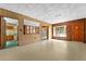 Bright living room with kitchen and exterior views at 11451 Pala Verda Ave, Leesburg, FL 34788