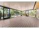 Spacious screened porch with composite decking and backyard views at 11451 Pala Verda Ave, Leesburg, FL 34788
