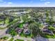 Scenic aerial view of neighborhood with a lake and homes at 11584 Se 175Th St, Summerfield, FL 34491