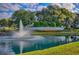 Elegant community entrance with a fountain and lush landscaping at 11584 Se 175Th St, Summerfield, FL 34491