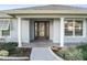 Welcoming front entrance with a stained glass door and columns at 11584 Se 175Th St, Summerfield, FL 34491