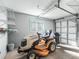 Garage with riding lawnmower and storage shelves at 11584 Se 175Th St, Summerfield, FL 34491