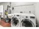 Laundry room in garage with LG washer and dryer at 11584 Se 175Th St, Summerfield, FL 34491
