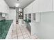 Laundry room with utility closet, white cabinets, and green countertop at 11584 Se 175Th St, Summerfield, FL 34491