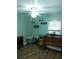 Cozy bedroom with wood-look flooring and ceiling fan at 12141 Lake Pines Rd, Leesburg, FL 34788
