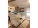 Living room with dual recliner couch, wood floors and blue painted walls at 12141 Lake Pines Rd, Leesburg, FL 34788