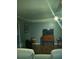 Living room with flat-screen TV, wood floors, and blue painted walls at 12141 Lake Pines Rd, Leesburg, FL 34788