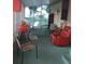 Screened patio with seating, grill, and view of backyard at 12141 Lake Pines Rd, Leesburg, FL 34788