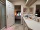 Bathroom with shower, vanity, and view of bedroom at 1335 E Schwartz Blvd, Lady Lake, FL 32159