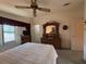 Bright bedroom with double bed, dresser, and window coverings at 1335 E Schwartz Blvd, Lady Lake, FL 32159