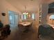 Bright dining room with table and chairs, offering a view into another room at 1335 E Schwartz Blvd, Lady Lake, FL 32159