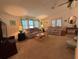 Relaxing living room featuring comfortable seating and large windows at 1335 E Schwartz Blvd, Lady Lake, FL 32159