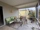 Relaxing screened porch with seating area at 1335 E Schwartz Blvd, Lady Lake, FL 32159