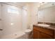 Clean bathroom with a shower/tub combo and wood vanity at 1378 Cottage Cir, Tavares, FL 32778