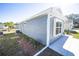 Gray house exterior with white trim and landscaping at 1378 Cottage Cir, Tavares, FL 32778