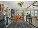 Dining area with large windows overlooking the outdoors and holiday decorations at 1715 Lilly Ln, Lady Lake, FL 32159