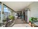 Spacious Florida room with a golf cart and ample seating at 1715 Lilly Ln, Lady Lake, FL 32159