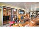 Florida room with leather furniture, fireplace, and holiday decor at 1715 Lilly Ln, Lady Lake, FL 32159