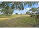 Scenic view of the golf course with green fairways at 1715 Lilly Ln, Lady Lake, FL 32159