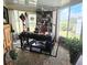 Bright and spacious home office with large windows and comfortable seating at 1715 Lilly Ln, Lady Lake, FL 32159