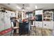 Festive kitchen with white cabinets, black island, and holiday decor at 1715 Lilly Ln, Lady Lake, FL 32159