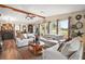 Living room with large windows, fireplace, and festive decor at 1715 Lilly Ln, Lady Lake, FL 32159