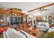 Living room with a wooden entertainment center and two sofas at 1715 Lilly Ln, Lady Lake, FL 32159