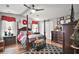 Main bedroom with four-poster bed, dark wood furniture, and patterned rug at 1715 Lilly Ln, Lady Lake, FL 32159