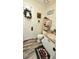 Small half bathroom with white vanity and wood-look flooring at 1715 Lilly Ln, Lady Lake, FL 32159