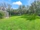 Fenced backyard with a playset and plenty of space for outdoor activities at 3556 Creek Run Ln, Eustis, FL 32736