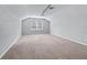 Spacious bonus room with neutral gray walls and plush carpeting at 3556 Creek Run Ln, Eustis, FL 32736