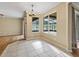Bright dining area with tile floors and large windows overlooking backyard at 3556 Creek Run Ln, Eustis, FL 32736